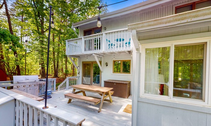 Lakeside Woods House | Lakefront home with hot tub, WiFi, dock, lake views, AC, & wood fireplace