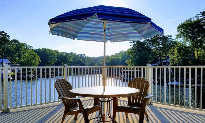 New London House | Lakefront Luxe Retreat in Tranquil Cove Endless Enjoyment Lakeside Fireplace
