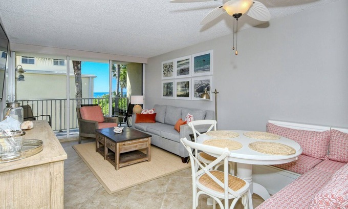 Longboat Key Apartment | LaPlaya 202E-Catch the gentle Gulf breezes on your private balcony beneath the swaying palms.