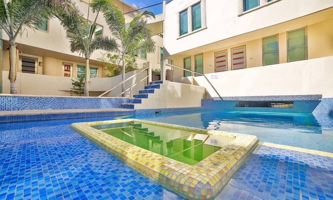 Gonzalo Guerrero Condo | Large, Modern Condo w/ Balcony overlooking 5th Ave. 4 min. Walk to the Beach!