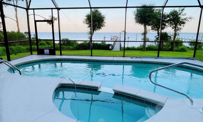 Carrabelle House | Lily’s Escaped, Private screen cover pool, fishing dock,