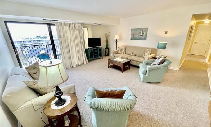 Rehoboth Beach Condo | LINENS & DAILY ACTIVITIES INCLUDED! OCEANFRONT/BOARDWALK BUILDING W/ROOFTOP POOL Furnished for comfort after a day in the sun. Relax in this 1100 sq ft unit with great southern exposure and lovely ocean views
