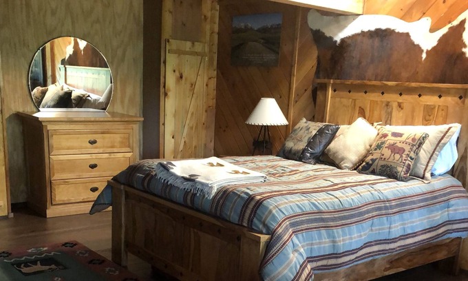 Bigfork Apartment | Log home studio in the woods. Pet friendly.