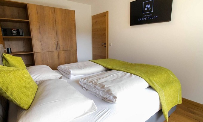 Mariapfarr Apartment | Lovely apartment for 4 guests with WIFI, pool, hot tub, TV, terrace and parking