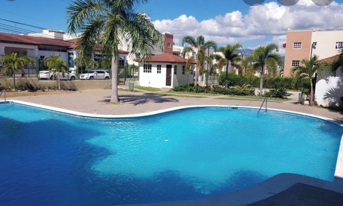 Gregorio Luperon Apartment | Luxury condo with pool gym parking wifi and more
