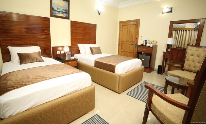 D.H.A. Hotel | Luxurious Deluxe Twin Room, Fully Furnished with 2 Single Beds.