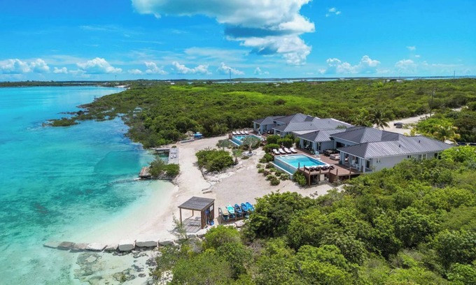 Hartswell Villa | Luxury beachfront villa with dock and a private large heated pool. For 10 people
