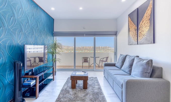 El Medano Ejidal Apartment | Luxury condo with shared gym, rooftop pool, and centrally located