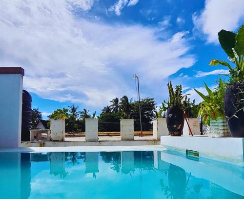 Paje Villa | Luxury Penthouse with private rooftop pool prime location Paje Beach Zanzibar TV WIFI AC steps to the beach