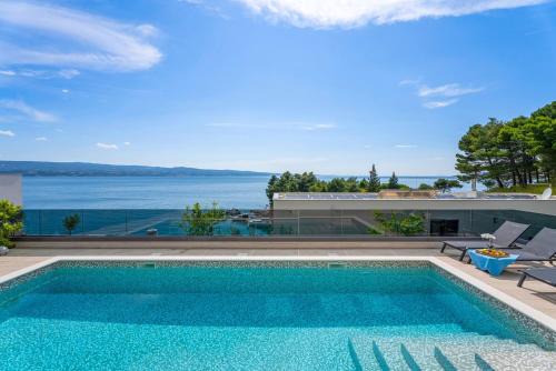 Omis Villa | Luxury, seafront Villa IVAN with heated pool only 100m from beach