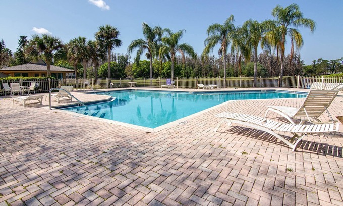 Fairway Village House | Magnolias on Cobblestone – Stylish Pet Friendly Retreat w/Private Lanai, Pool Access & Smart TVs!