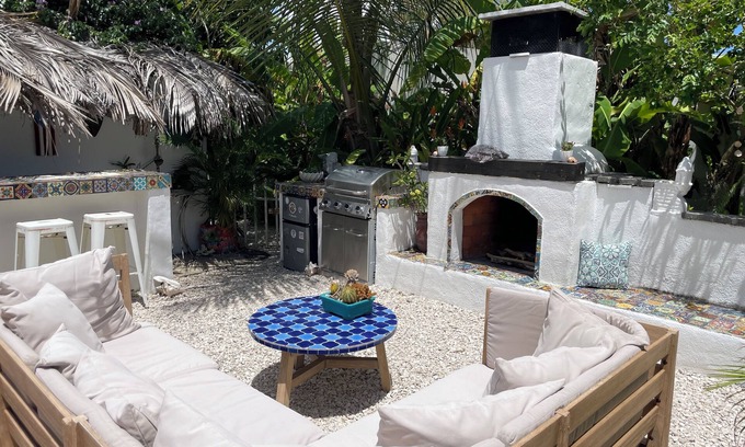 Bajo House | Malecon Beach House with beautiful backyard. Steps from the Caribbean ocean.
