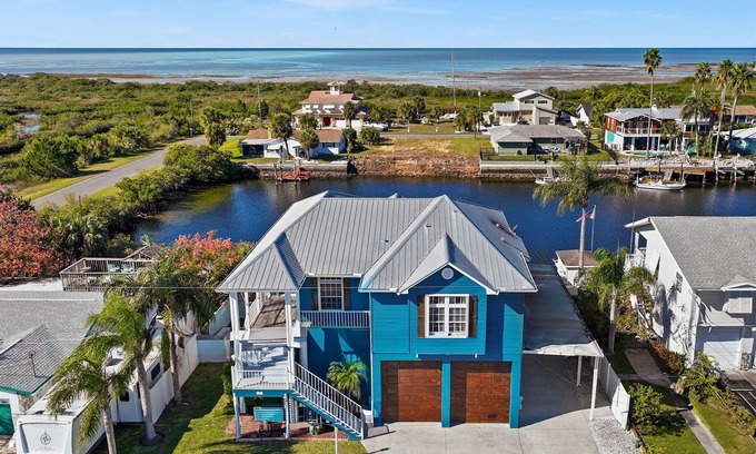 Spring Hill House | Manatee time! Waterfront Home, floating dock, kayaks, paddle boards, gulf access