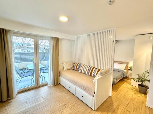 Olymbiaki Akti House | Minimalist Seaside Apartment with Private Patio and Parking - Blue Zone Homes