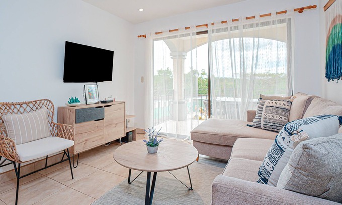 Villarreal Condo | Modern condo near beaches with mountain views, outdoor pool, balcony, W/D, AC