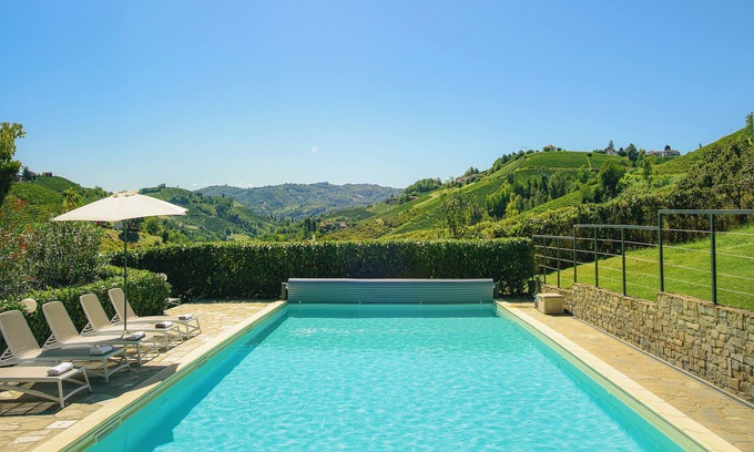 San Bovo Villa | Modern villa with private pool and panoramic vineyard views in Piemonte.