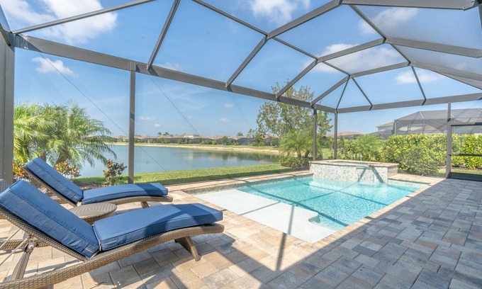 Naples House | 🌴 Naples Reserve Lakeview Escape | Lanai w/Pool & Hot Tub, Outdoor Kitchen, EV & Pet Friendly