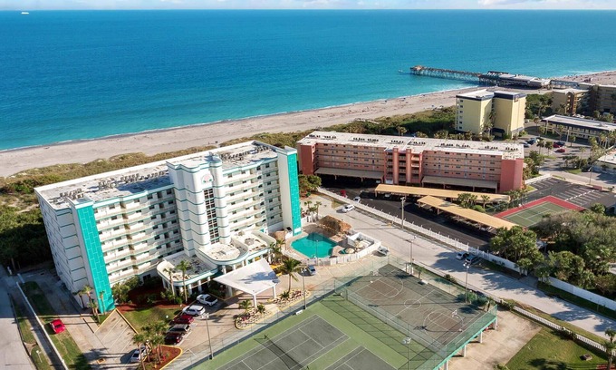 Port Canaveral Condo | Ocean Front Resort - 2BR Condo -Near the Pier - Tiki Bar - Pool - Game Room