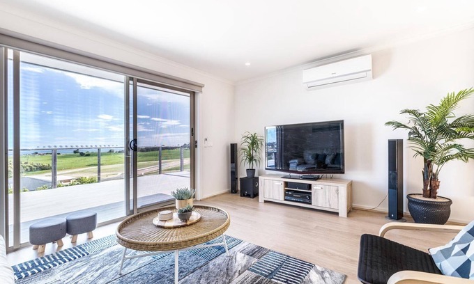 Lakes Entrance House | Ocean Vista - A view of the ocean over the large backyard