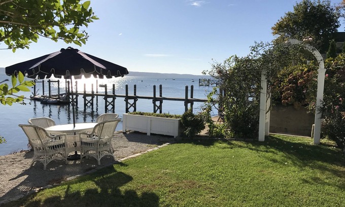 Bristol Cottage | Old fashioned designer front porch living by the sea with expansive water views.