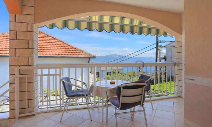 Municipality of Trogir Apartment | One bedroom apartment with terrace and sea view Arbanija, Čiovo (A-18797-b)