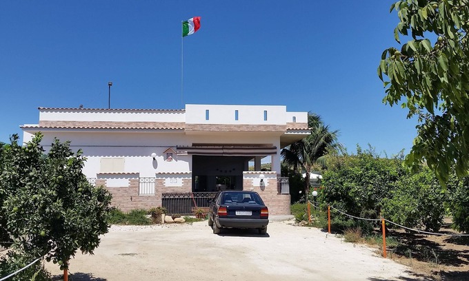 Sciacca House | Orange and lemon villa with garden and aromatic herbs.