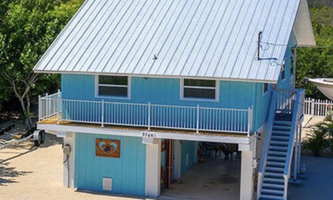 Port Pine Heights House | PADGETT PARADISE with Two Boat Slips with Filet Table. POOL