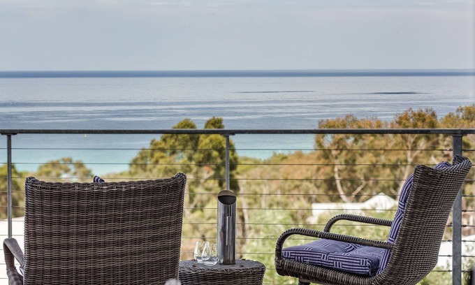 Eagle Bay House | PANORAMIC VISTAS OF THE PRISTINE COASTLINE & TURQUOISE WATERS OF EAGLE BAY.