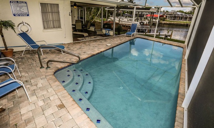 Mid Island House | Peaceful, spacious canal-front home w. private screened-in pool
