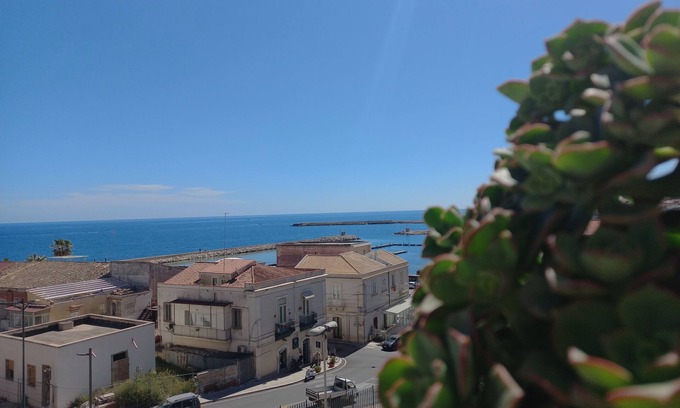 Eastern Sicily House | Penthouse with terrace, sea front overlooking Ortigia and its monuments.
