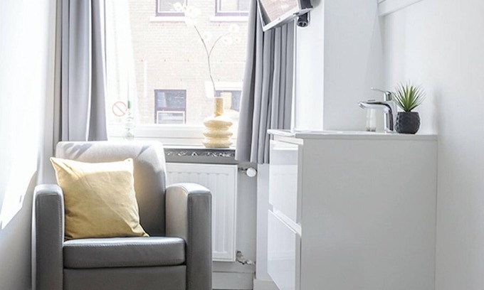 Centrum Apartment | Perfect for solo travelers looking for a simple and budget-friendly base. This cozy room comes with a TV and workspace, and you’ll have access to a shared kitchen and shared bathroom.
