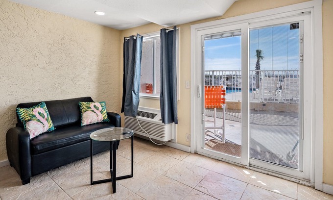 Panama City Beach Condo | Pet Friendly Ground Level Steps to the Sand! Pool Hot Tub WIFI