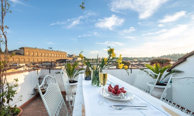 Oltrarno Apartment | Pitti Luxury Terrace in Florence, a terrace overlooking Florence by Mmega