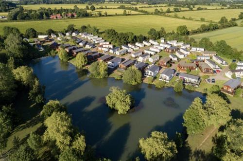 Saxmundham House | Platinum lakeside Lodge on resort with fishing