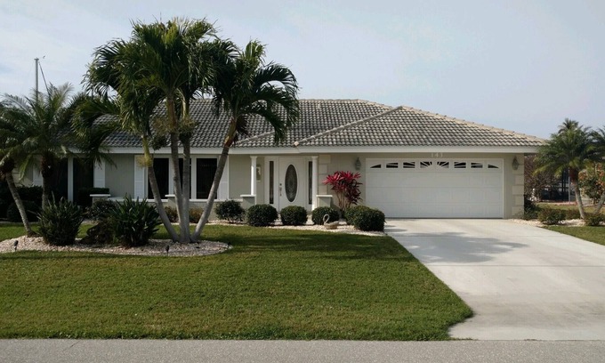 Punta Gorda House | Pool house on a lagoon with sunset view