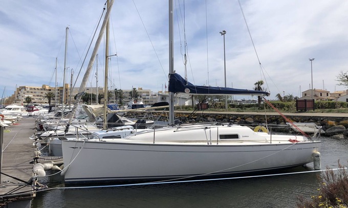 Naturist Village Boat Rental | Pretty sailboat at the quay on the quiet side of the naturist port