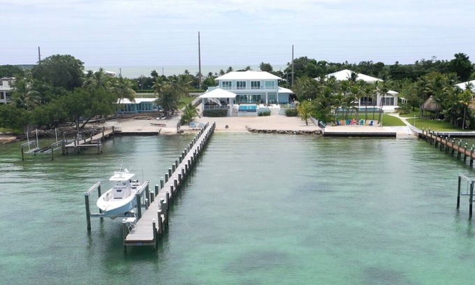 Key Largo House | Private Beach Bayside 6 Bedroom Resort Home with Pool, Dock, & Garage