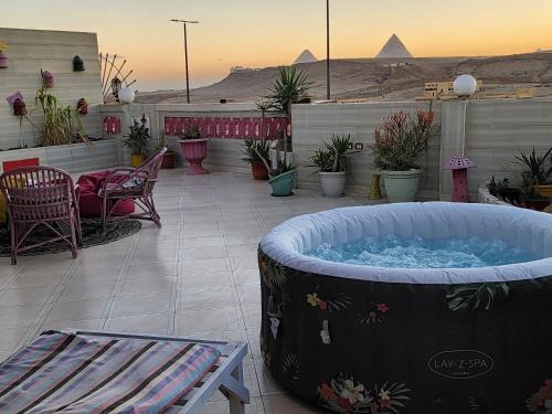 Pyramids Gardens Apartment | private rooftop with hot jacuzzi and pyramids view