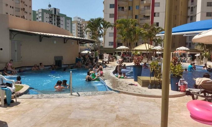 Do Turista Apartment | Privé das Hhermas, 2 bedrooms one suite kitchen and living room with TV
