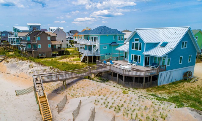 Village of Stump Sound House | Quaint beachfront cottage with Ping-Pong table, decks, community pool & views
