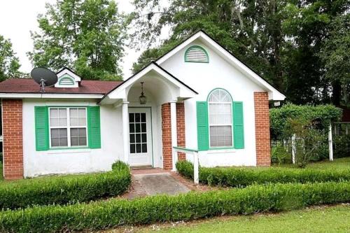 Midway House | Quaint Cottage with Covered Dock on the Pond and Walking Trails in Georgia