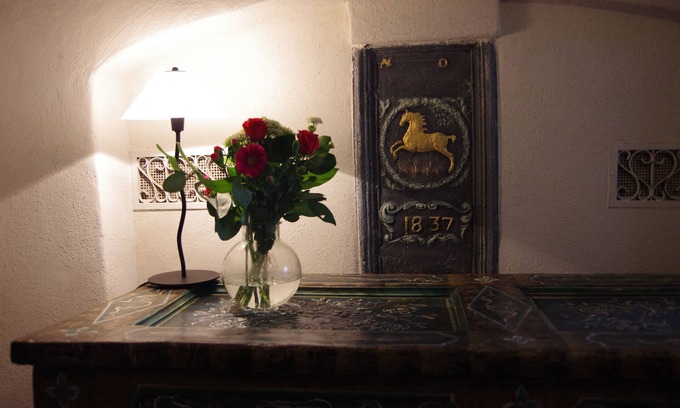 Hofen Apartment | Quaint, old farmhouse from 1837 invites you to linger.
