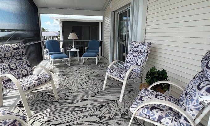 Saint James City House | Quiet, clean & comfy 2 bed-2bath with 8000lb boat lift and large screened lanai