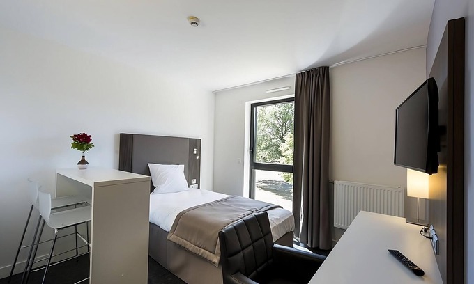 Dijon Hotel | Refreshing Stay with Free Offsite Parking! Pet Friendly Property!