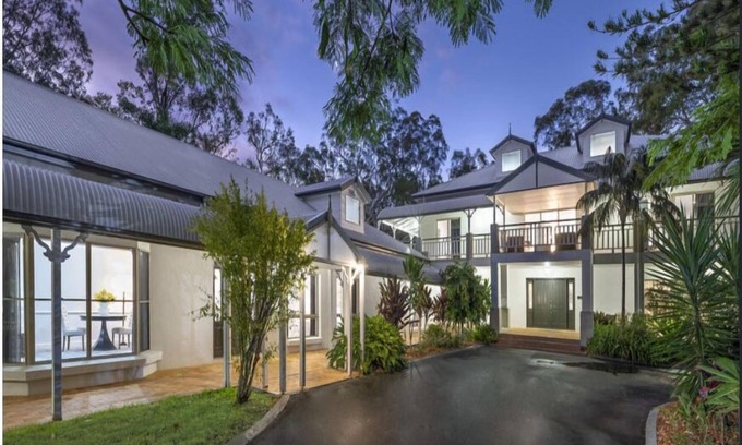 Carbrook House | Relax with your whole family at this serene resort-style retreat.