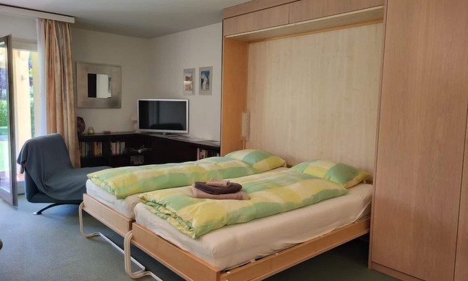 Caslano Apartment | Residenza Parcolago Apt 018 mit Garten by Interhome