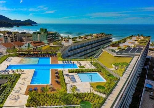 Praia Grande Apartment | Resort frente ao mar apto 1222 DNA Praia Grande