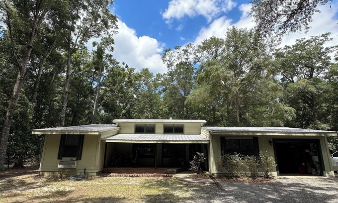 High Springs House | Riverfront Forest Retreat - Near Springs & UF! 3BR/2BA on the Santa Fe River!