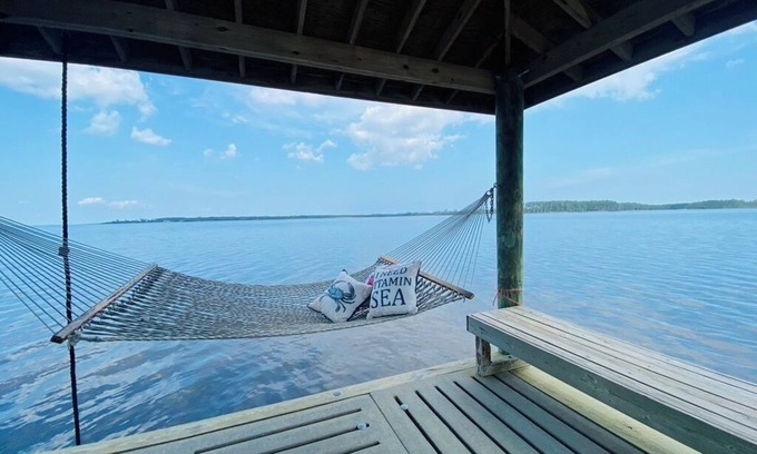 Hobucken House | Riverfront property with dock and ramp. Dolphins, fish, boat, swim & more