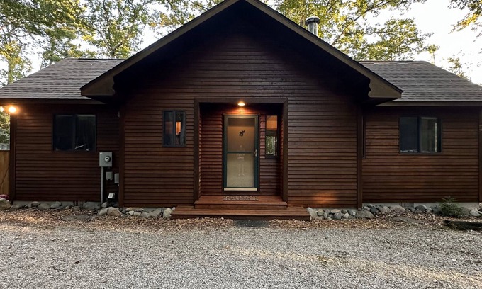 Rapid City Cabin | Riverside Cabin Near Torch Lake – Kayaks Included!